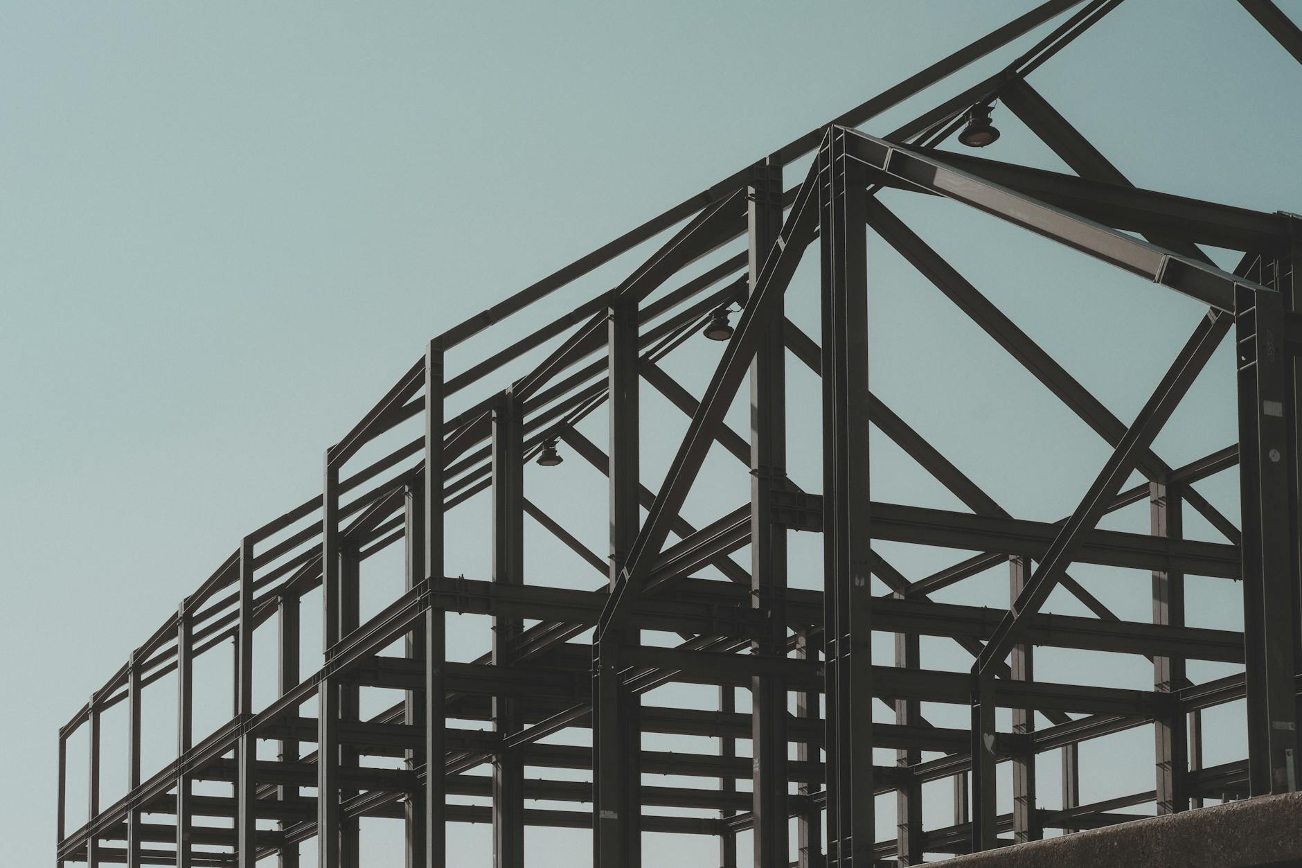 structural steel frame against clear sky